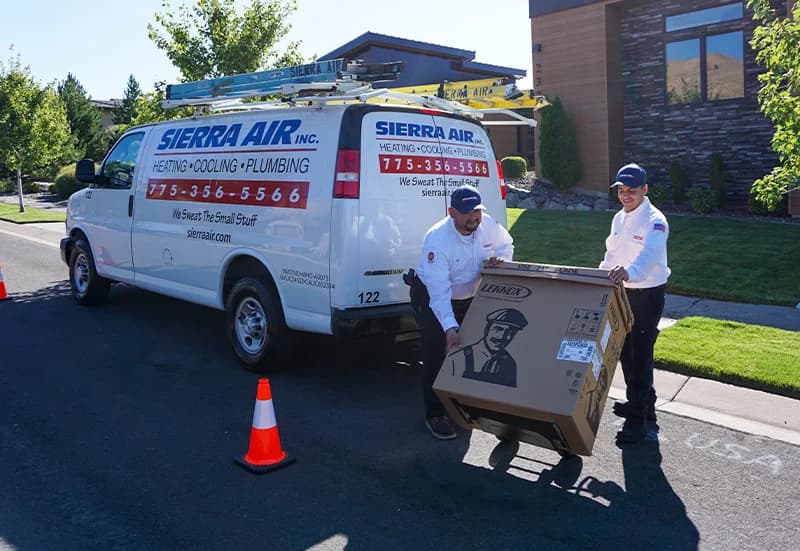 Technicians unloading delivering AC unit (3)