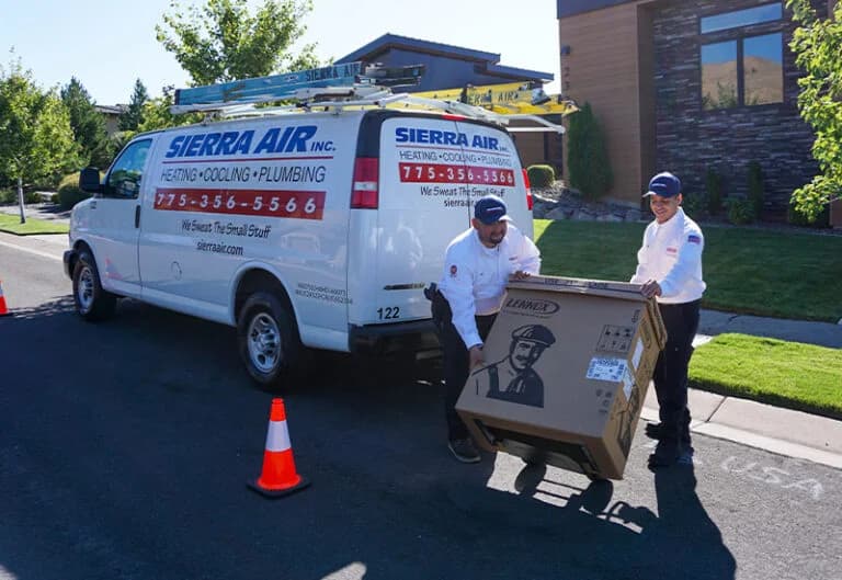 Technicians unloading delivering AC unit (3)