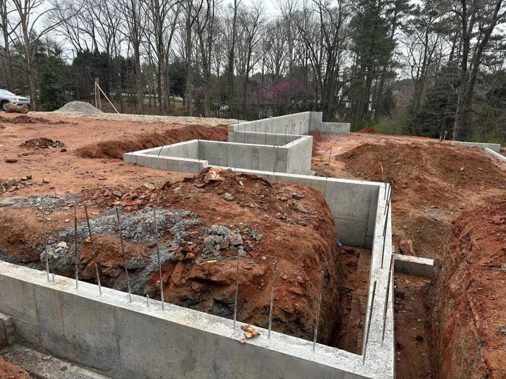 Concrete foundation walls and retaining wall structures for residential grading.