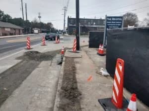 Road construction services with curbs and gutters by paving contractor at Bristol site