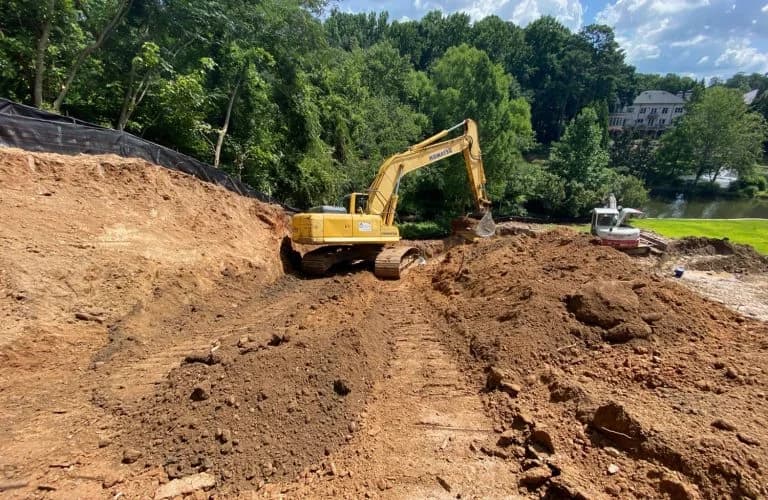 Excavation work by land development contractors for site preparation near water