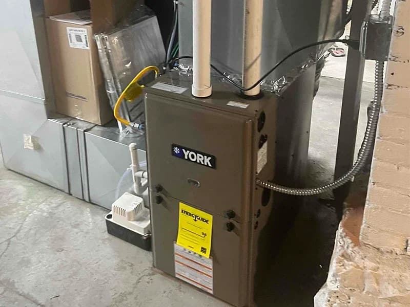 A clean installation of a York TM9E high efficiency furnace by Bills Heating and AC.