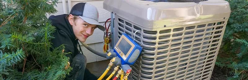 an air conditioning technician smiles