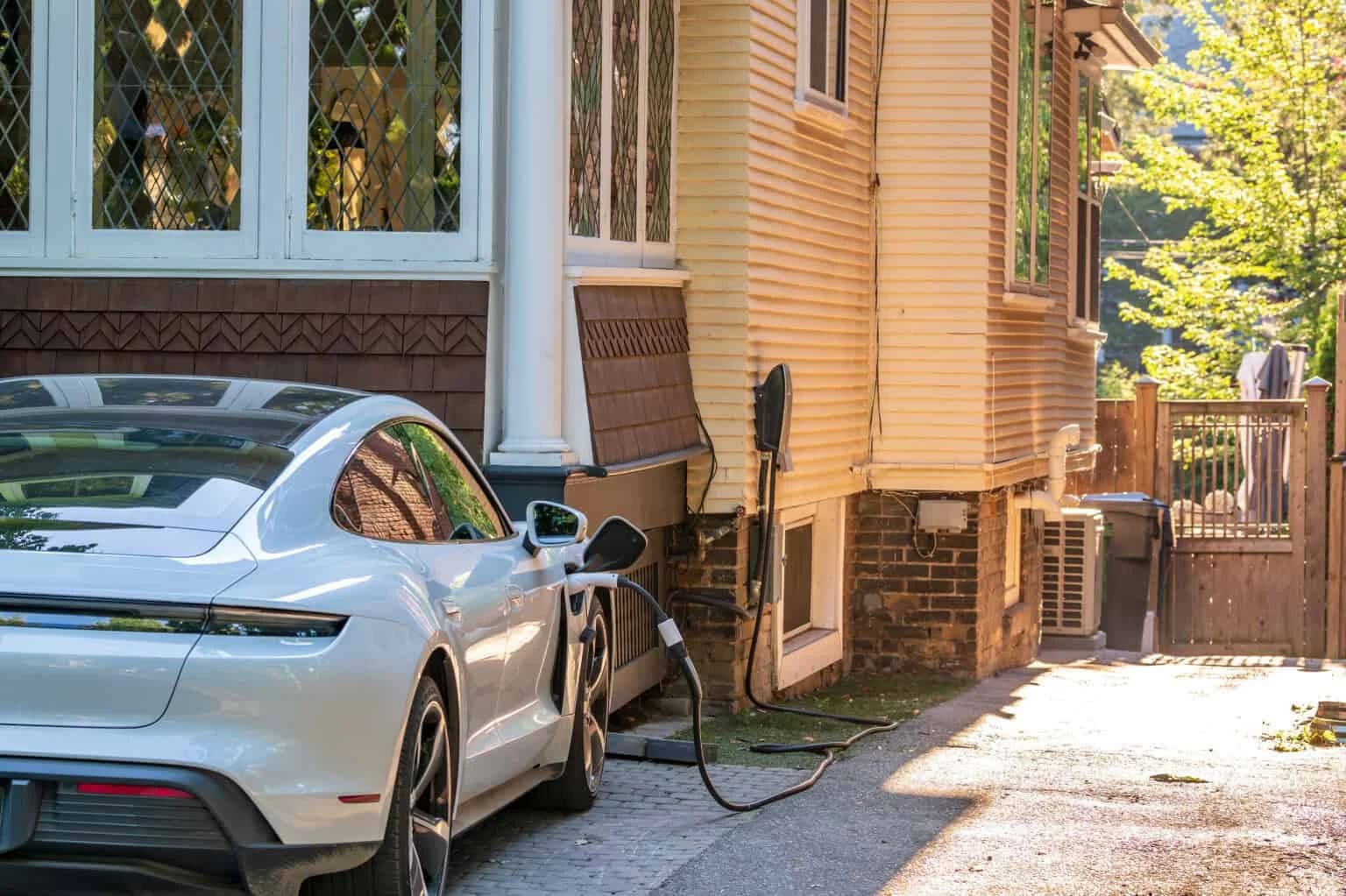EV charger being installed on a residential house for electric vehicle charging.