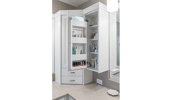 White cabinets with a tan countertop in a newly renovated bathroom