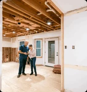 Two people inspecting a home renovation project.