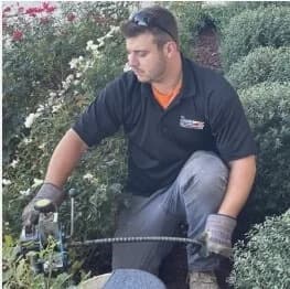 technician-cleaning-drain