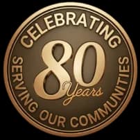 Badge Celebrating 80 Years Serving Our Communities