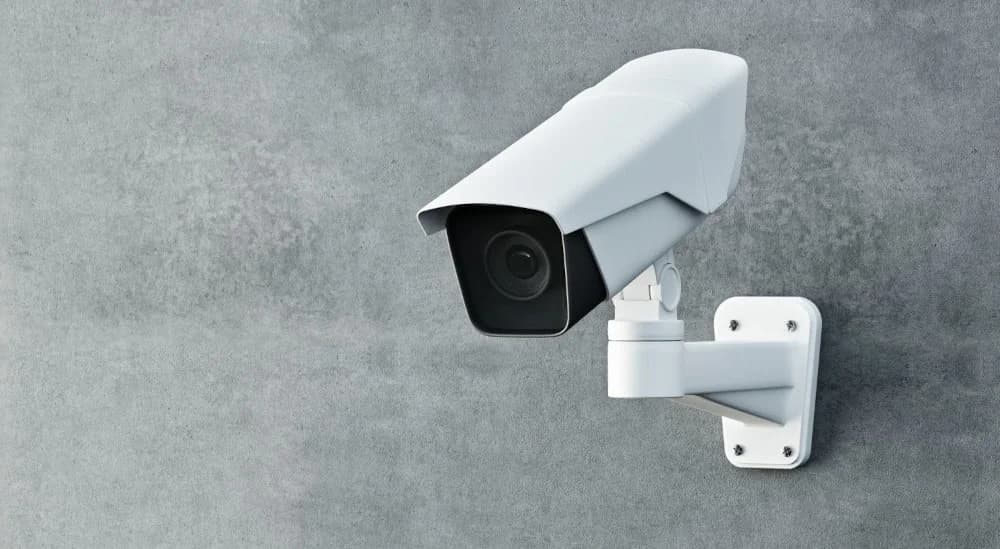 A surveillance camera installed at an entrance to increase security.
