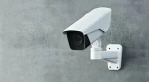 A surveillance camera installed at an entrance to increase security.