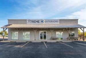 Exterior of the Xtreme Exteriors Shop building and and parking lot