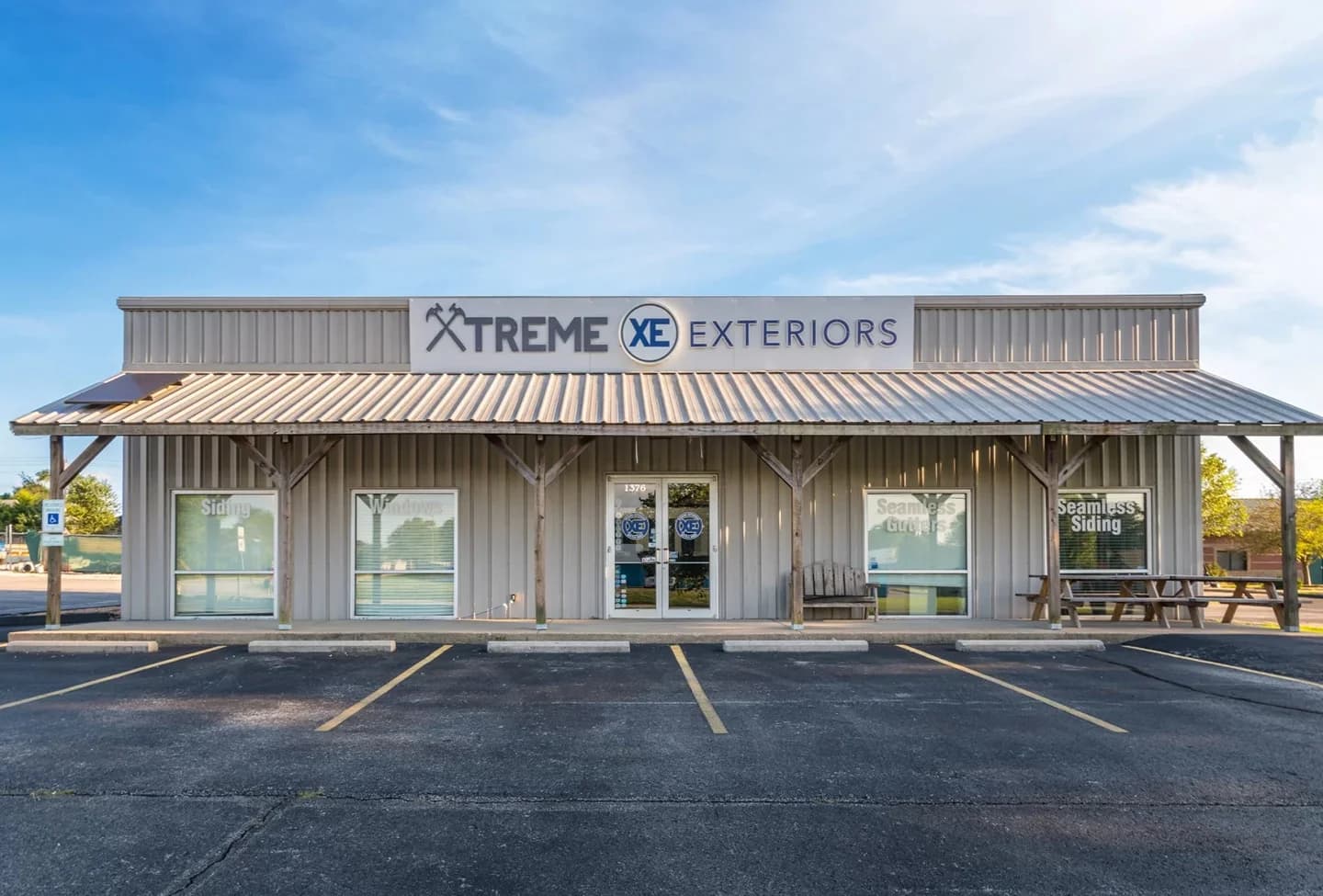 Exterior of the Xtreme Exteriors Shop building and and parking lot