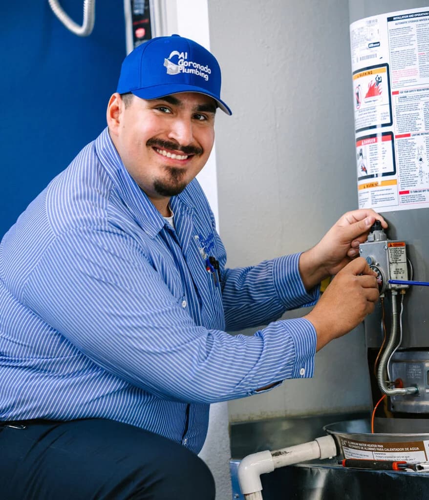Al Coronado plumbing expert working on a water heater installation