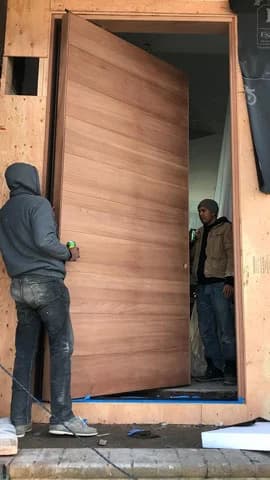 Commercial pivot door installation in New York