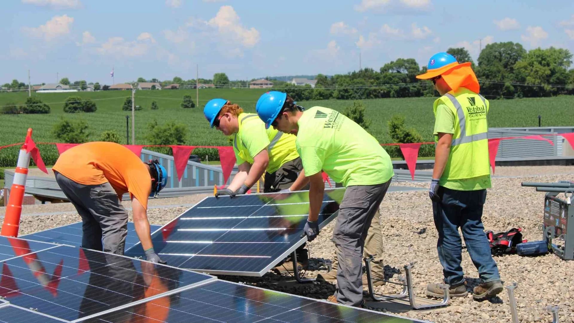 Westphal electricians securing rooftop solar panels as part of the Bridges Elementary School installation.