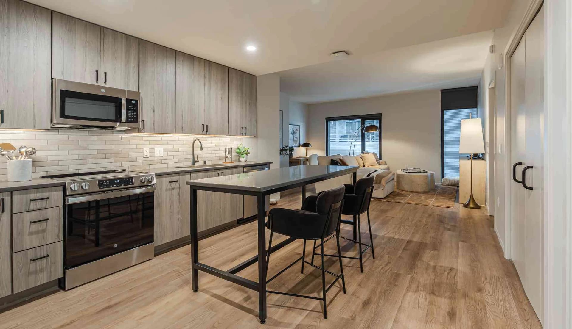 Modern apartment kitchen and living space inside One09 Apartments in downtown Madison
