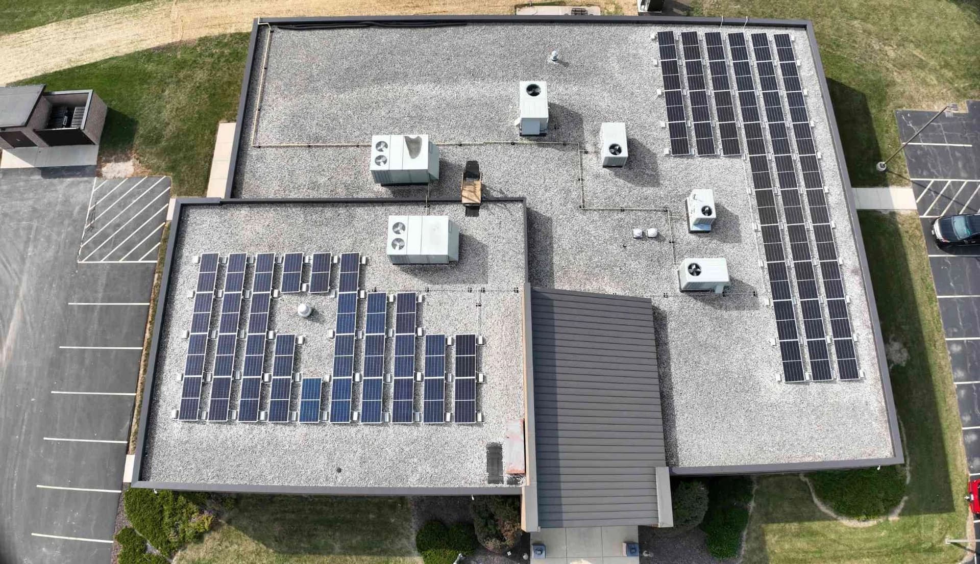 Aerial view of the ballasted rooftop solar array installed on the IBEW Local 494 building.
