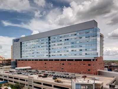 Freestanding, 12 story hospital with exterior windows and brick