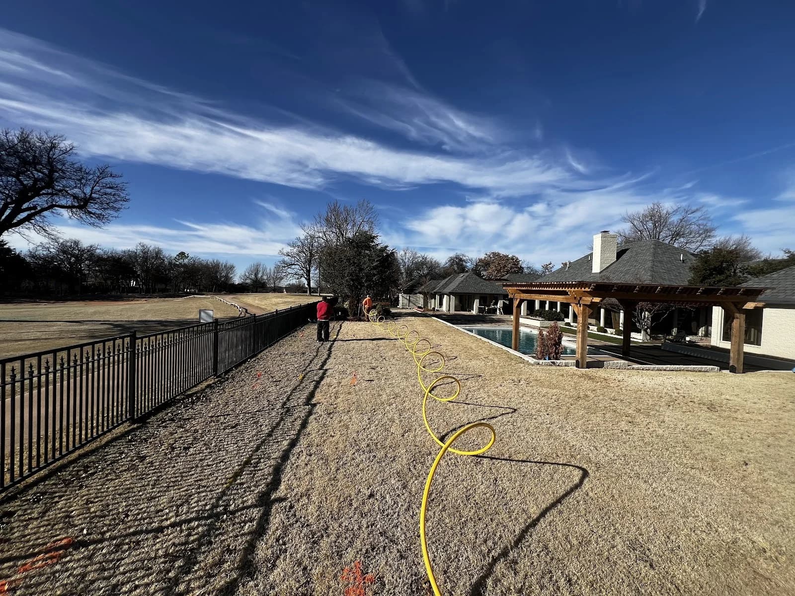 Trinity Boring Solutions residential yard bore trenchless water line under pool deck Oklahoma City no-dig installation
