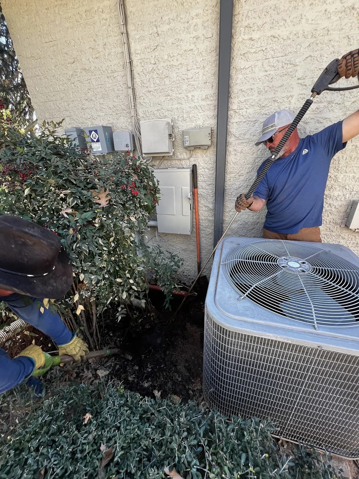 Trinity Boring Solutions worker bore under building foundation Oklahoma City residential utility service directional drilling