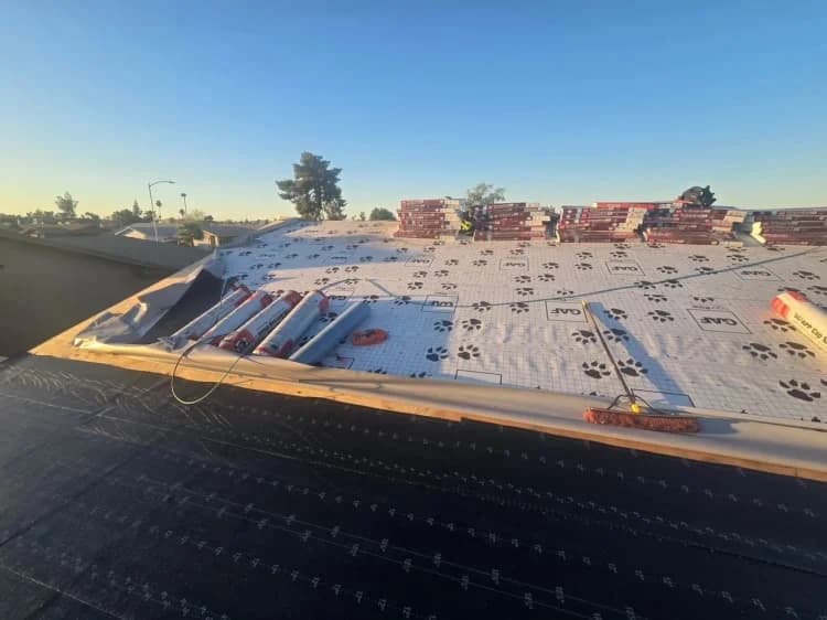 Roofers working on a house