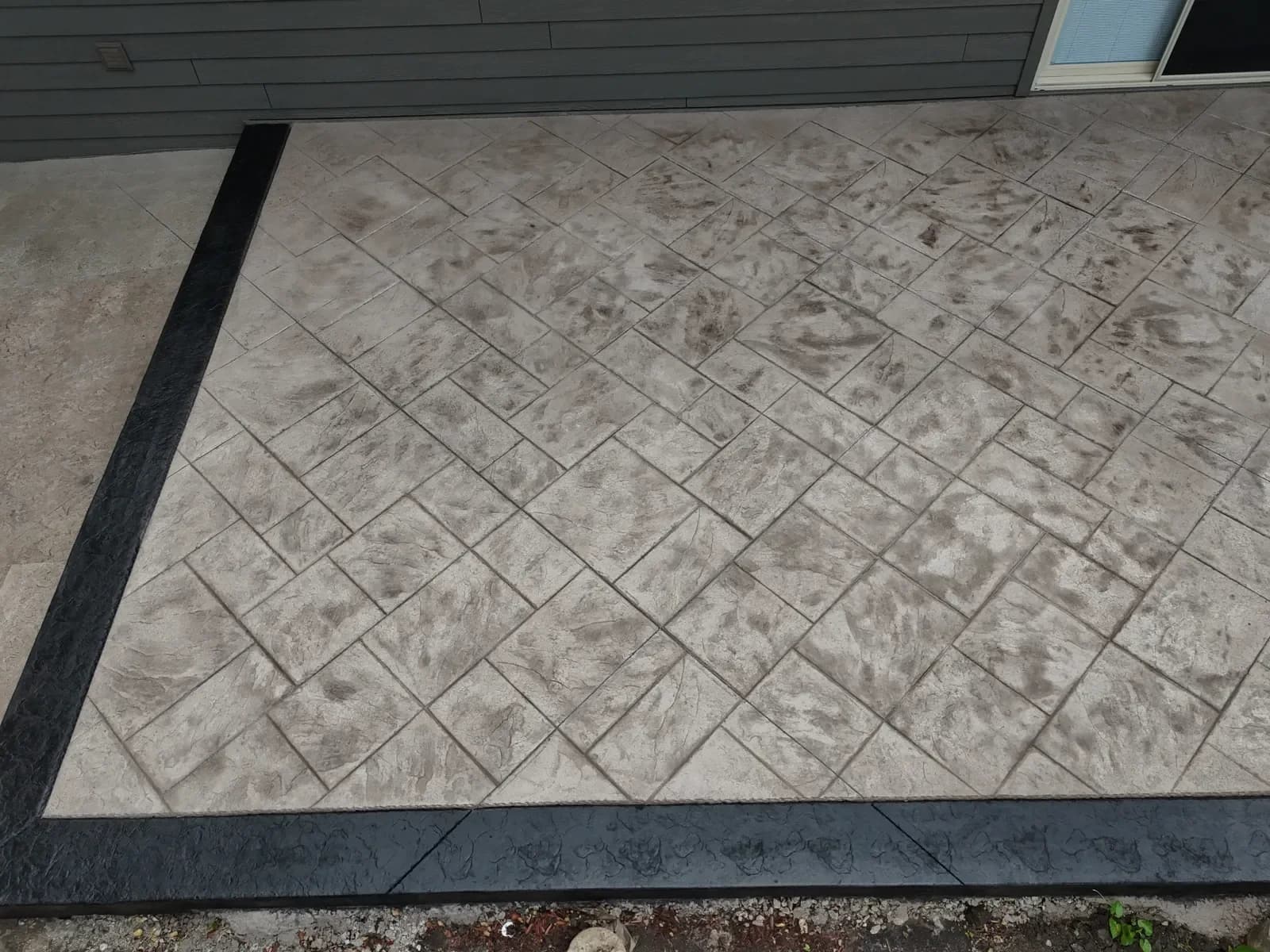 Herringbone stamped concrete texture close-up
