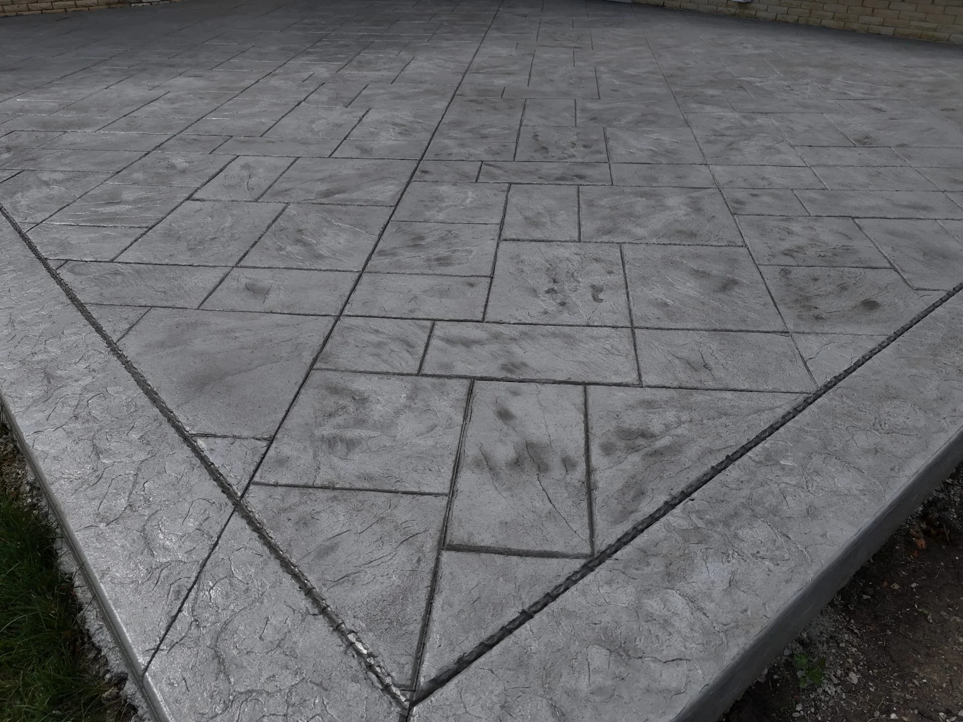 Concrete patio vs paver patio comparison — ZBL Concrete