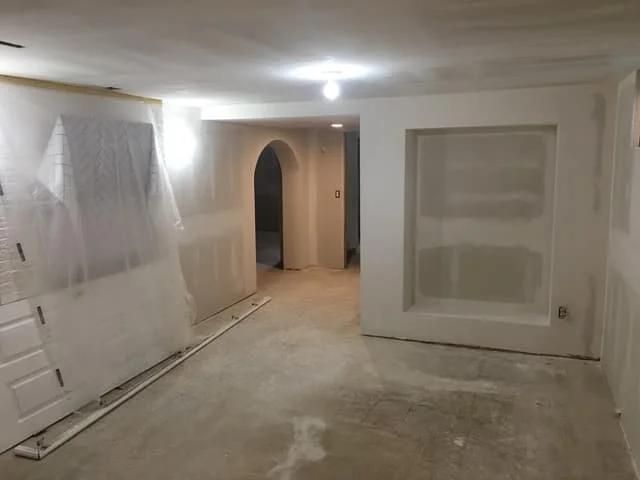 Drywall water-damage repair in Twin Cities home — replacing and refinishing damaged sheetrock walls.