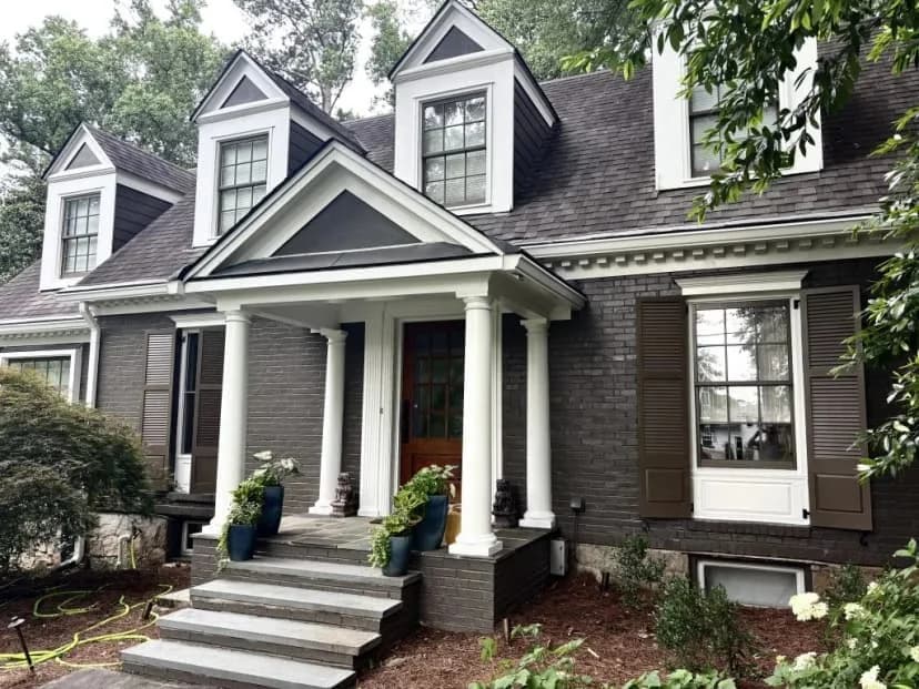 Dark brick colonial exterior with white columns painted by OVO Painting in Atlanta