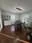 Formal dining room with white wainscoting, dark hardwood floors, and natural light from tall windows painted by OVO Painting in Atlanta