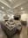 Double-height great room with white coffered ceiling, floor-to-ceiling windows, and built-in bookshelves painted by OVO Painting in Atlanta