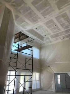A room with a metal frame and white walls.