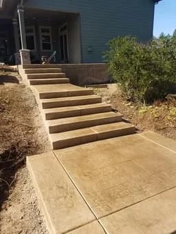 Custom concrete seating wall and fire pit area