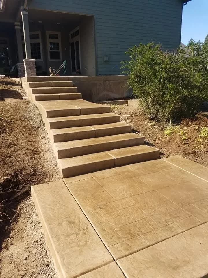 Custom concrete seating wall and fire pit area