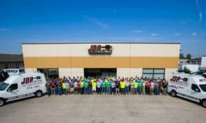 JDP team in front of the JDP building in Fargo, electricians and entire team