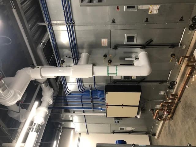 Commercial HVAC mechanical room with installed controls