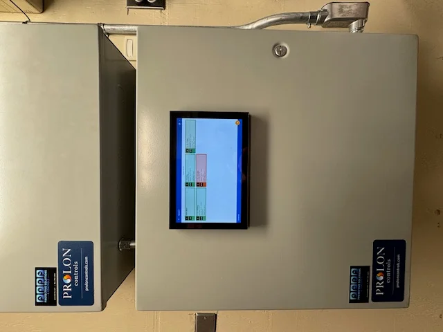 Building controls cabinet and low voltage control wiring in a commercial facility