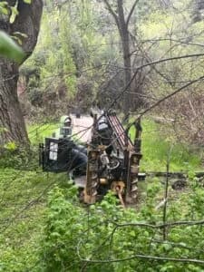 Drilling in the forest for a spring line