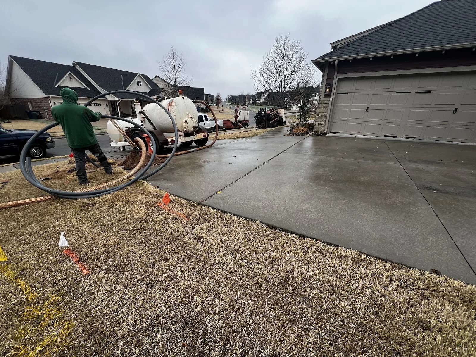 Trinity Boring Solutions crew member residential utility bore Oklahoma City green jacket locator Ditch Witch HDD operator