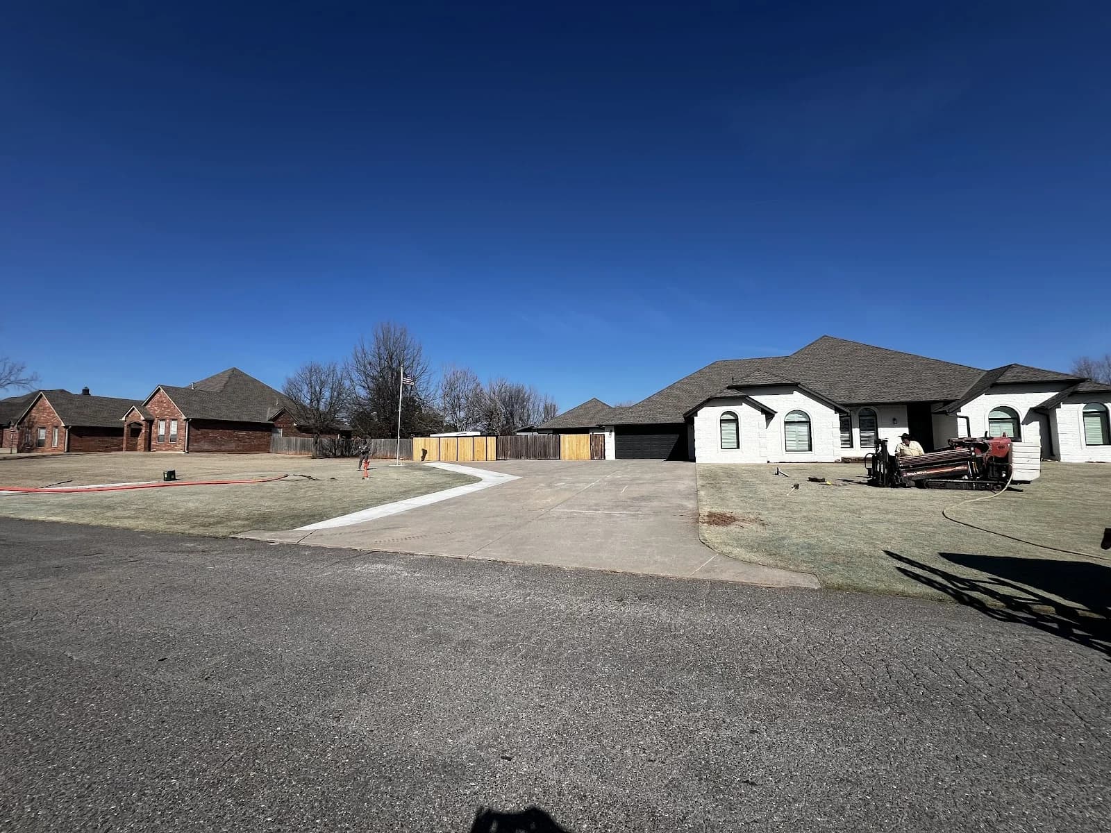 Trinity Boring Solutions residential directional bore driveway Oklahoma City neighborhood no-dig trenchless water line installation