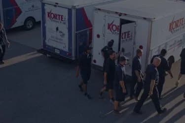 Korte Does It All banner image with trucks and employees