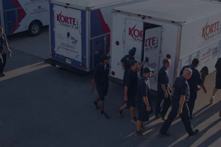 Korte Does It All banner image with trucks and employees
