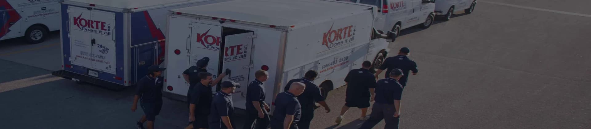 Korte Does It All banner image with trucks and employees