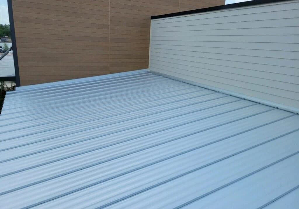 Metal roof with nearby vertical siding.