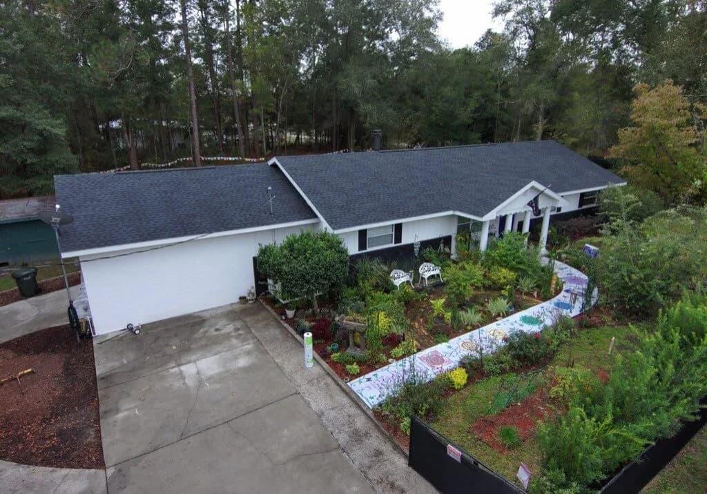 Aerial view of a garden-lined house.