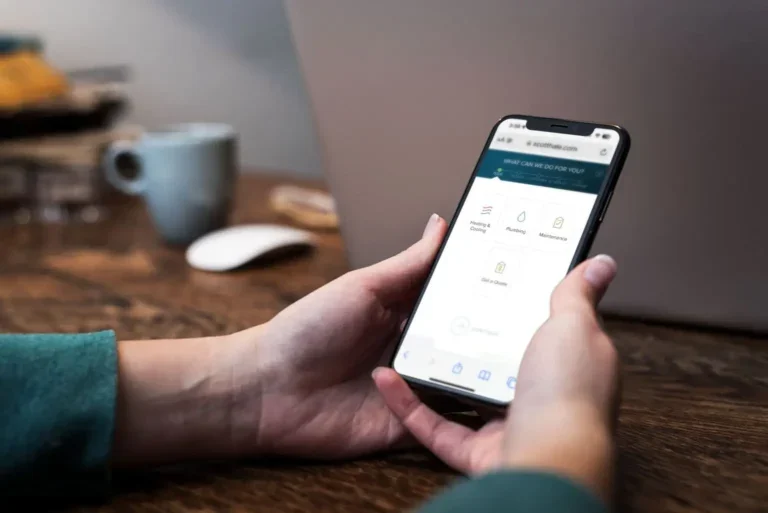person holding a phone with scheduling buttons