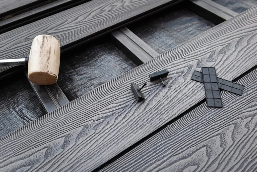 Installation services showing tools and composite decking materials in progress