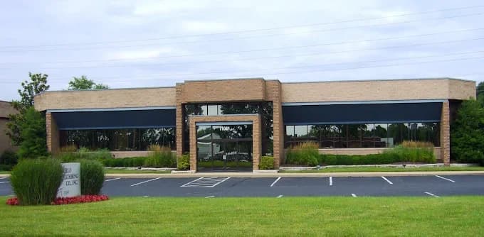 Single-story office building with parking lot.