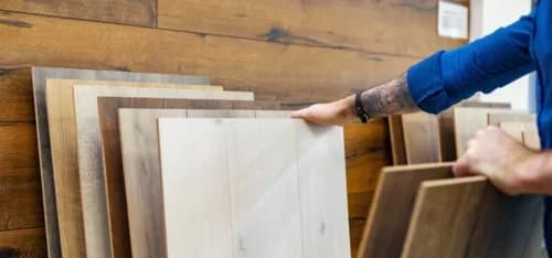 man looking flooring examples