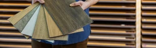 man holding floorings